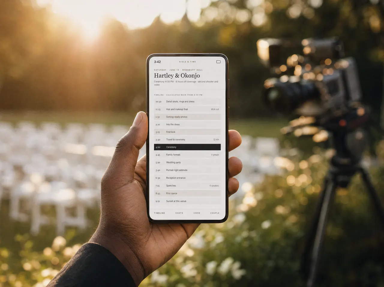 A hand holding a phone showing the coverage timeline, in warm outdoor light.