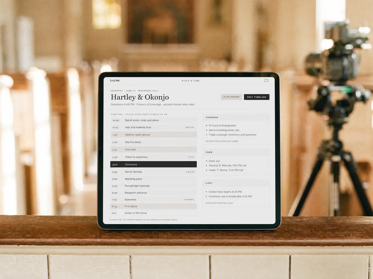 A tablet on a ballroom windowsill beside a camera on a tripod, showing the coverage timeline.