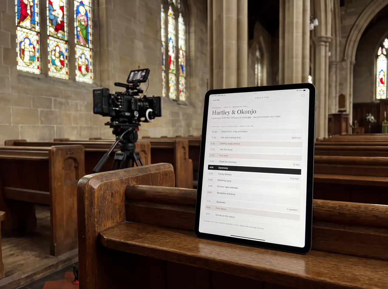 A tablet on a church pew beside a video camera, showing the coverage timeline.